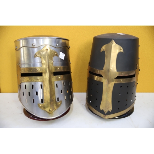 800 - Two Replica medieval Knights helmets made in Metal. Life Size. Each comes with purpose built wooden ... 