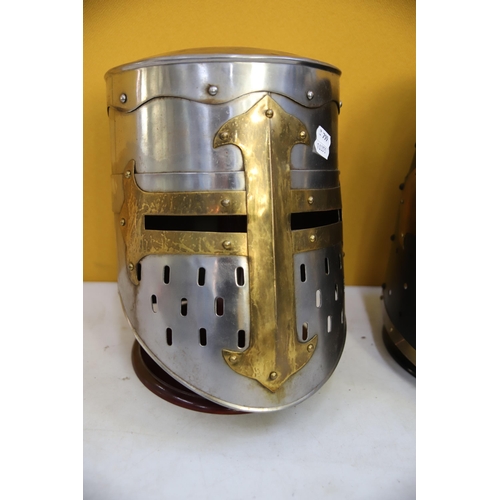 800 - Two Replica medieval Knights helmets made in Metal. Life Size. Each comes with purpose built wooden ... 