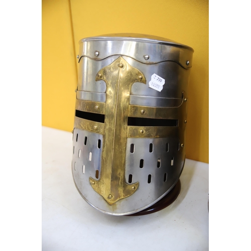 800 - Two Replica medieval Knights helmets made in Metal. Life Size. Each comes with purpose built wooden ... 