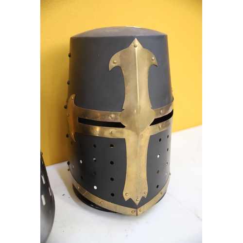 800 - Two Replica medieval Knights helmets made in Metal. Life Size. Each comes with purpose built wooden ... 