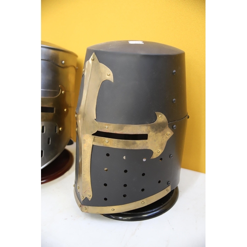 800 - Two Replica medieval Knights helmets made in Metal. Life Size. Each comes with purpose built wooden ... 