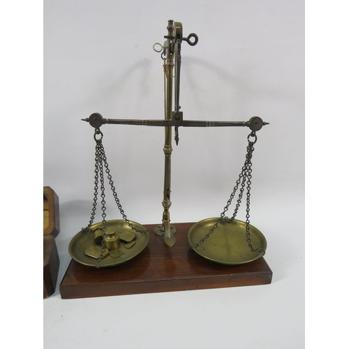 112a - Small set of vintage brass scales by W&T Avery plus a set of dutch brass weights in wooden case.