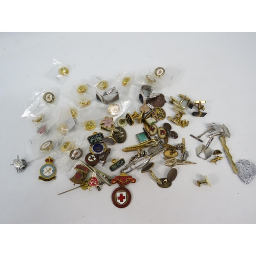 327a - Selection of Cufflinks, tie pins and pin badges.