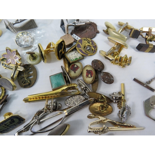 327a - Selection of Cufflinks, tie pins and pin badges.