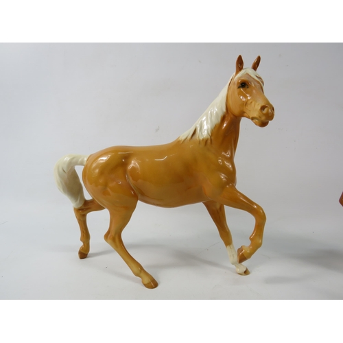 40a - Three Beswick Palomino horses.