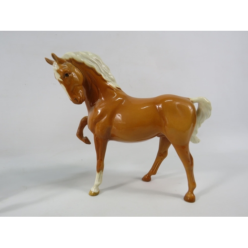 40a - Three Beswick Palomino horses.