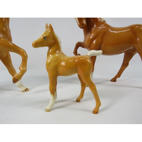 40a - Three Beswick Palomino horses.