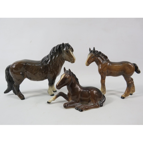 67a - Beswick Shetland pony plus two Beswick foals.