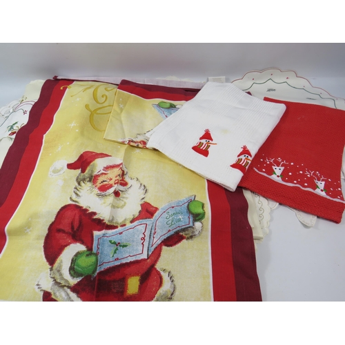 1092 - 8 x Christmas cushions, 5 x cushion covers, Table cloths, napkins, tea towels etc.