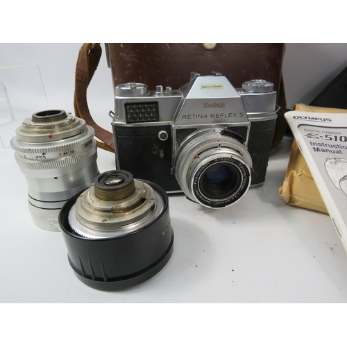 1109 - Olympus E-510 Digital SLR camera with accessories plus a vintage Kodak Retina Reflex.