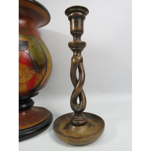 1111 - Large carved wooded vase and a pair of twisted carved wood candlesticks, the vase measures 12