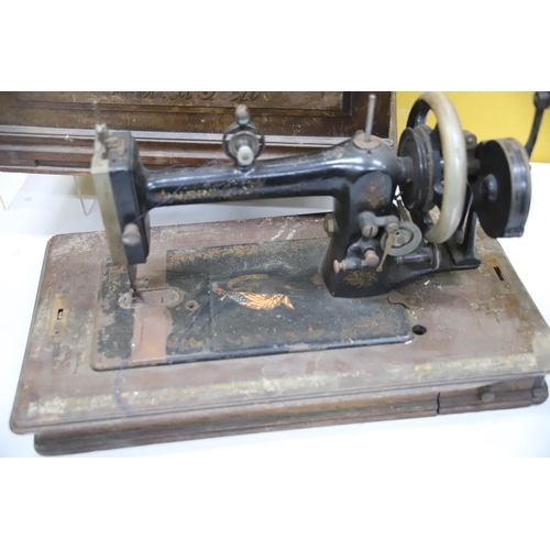 939 - THIS LOT HAS NOW BEEN WITHDRAWN BY THE VENDOR.
Antique Sewing Machine with original wooden Case. Mak... 