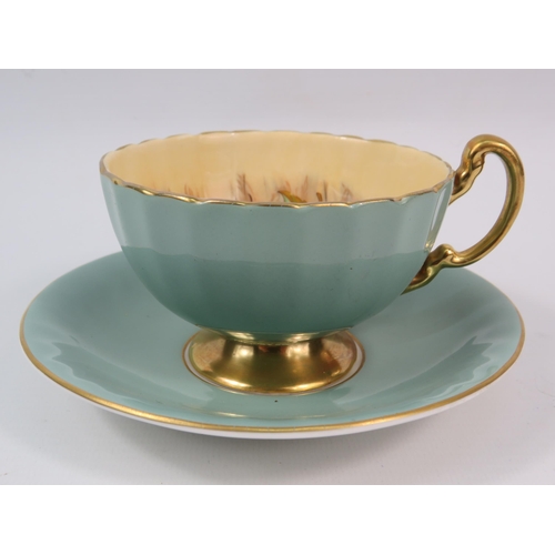 12 - Aynsley China sage green Orchard Gold cup and saucer.