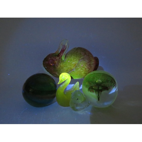 20 - Selection of Uranium glass paperweights including one by Wedgwood.