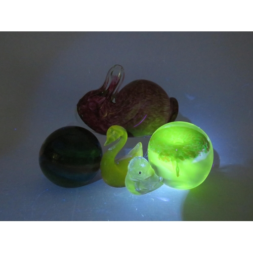 20 - Selection of Uranium glass paperweights including one by Wedgwood.