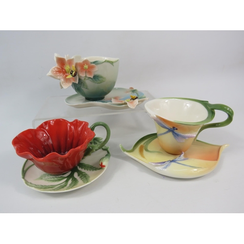 23 - Three Franz Porcelain cups and saucers, Poppy, Dragonfly and Bee patterns.