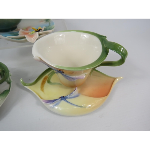 23 - Three Franz Porcelain cups and saucers, Poppy, Dragonfly and Bee patterns.