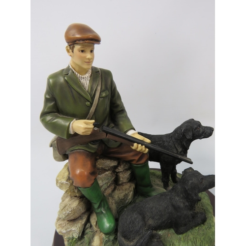 36 - Two Leonardo resin hunting / shooting and working dog figurines the tallest stands 13