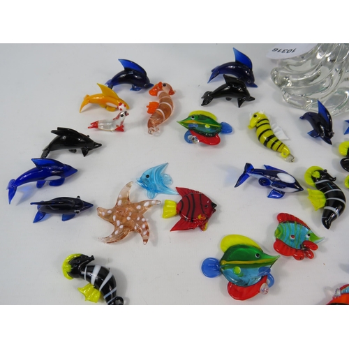 42 - Green and blue art glass dish with a large selection of murano style glass sea life figurines.