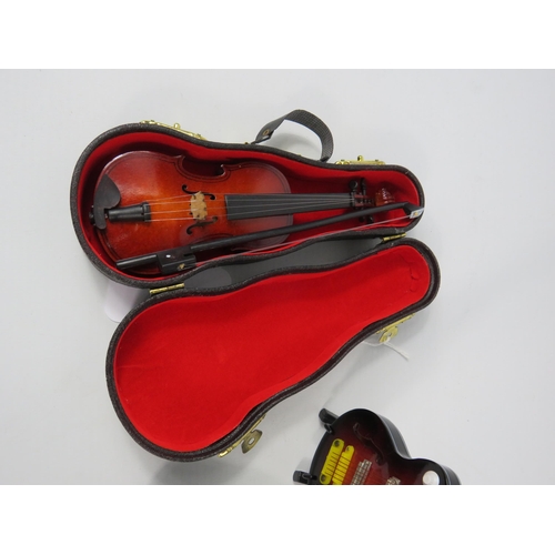 64 - Miniature Guitars and Violin (2 have cases) the largest measures 5.5