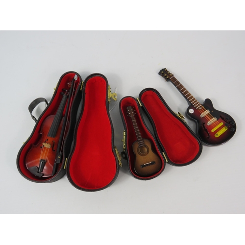 64 - Miniature Guitars and Violin (2 have cases) the largest measures 5.5