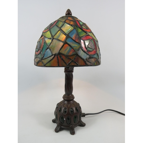 71 - Vintage Tiffany style lamp with bronze effect metal stand set with green stones, 13