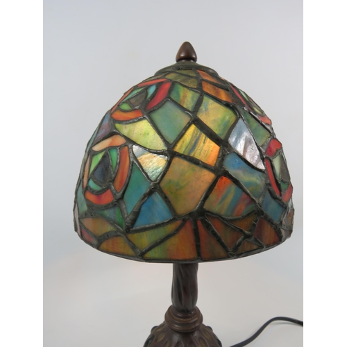 71 - Vintage Tiffany style lamp with bronze effect metal stand set with green stones, 13