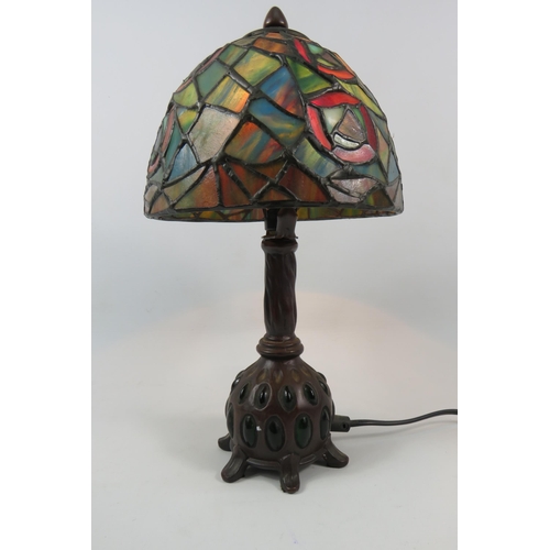 71 - Vintage Tiffany style lamp with bronze effect metal stand set with green stones, 13