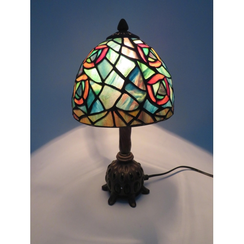 71 - Vintage Tiffany style lamp with bronze effect metal stand set with green stones, 13