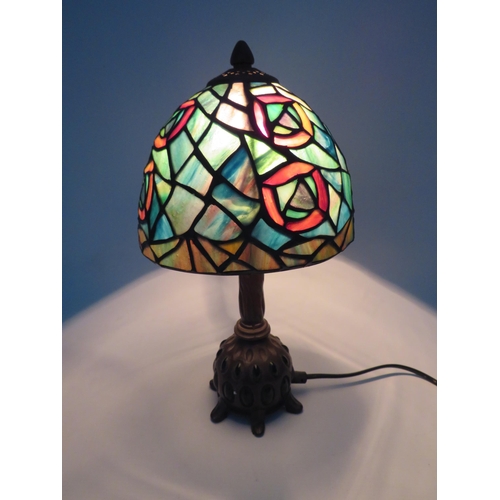 71 - Vintage Tiffany style lamp with bronze effect metal stand set with green stones, 13