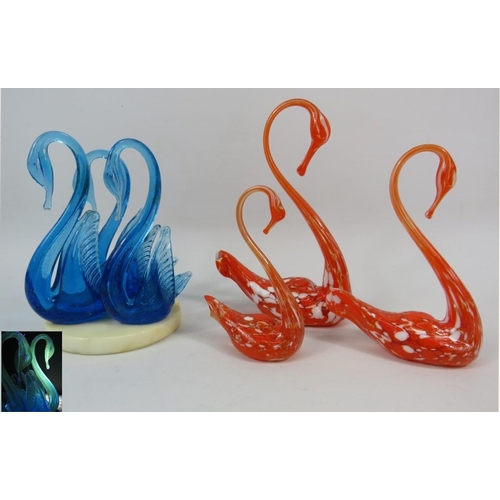 100 - Two sets of Murano art glass swans, one urainium set on a marble base and one orange and white speck... 