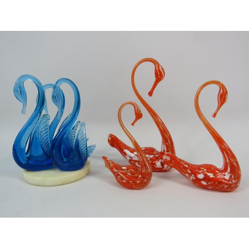 100 - Two sets of Murano art glass swans, one urainium set on a marble base and one orange and white speck... 