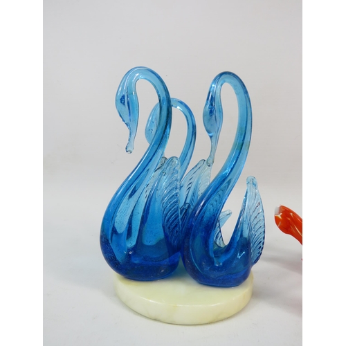 100 - Two sets of Murano art glass swans, one urainium set on a marble base and one orange and white speck... 