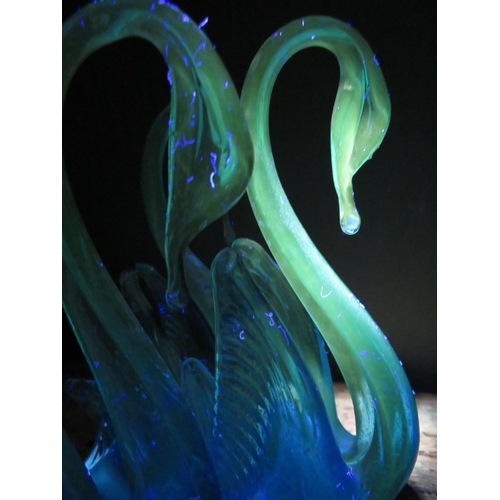 100 - Two sets of Murano art glass swans, one urainium set on a marble base and one orange and white speck... 