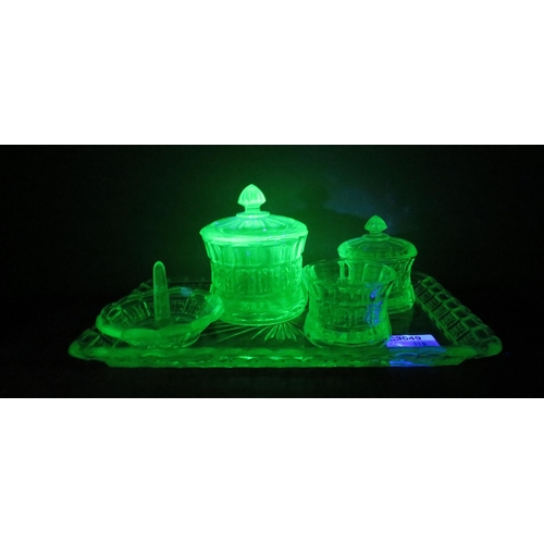 115 - Art Deco uranium glass dressing table set, the tray measures 12 1/4