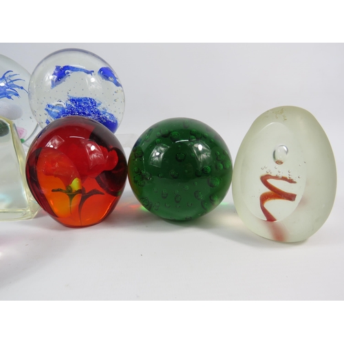 119 - Ten Art glass paperweights, the largest stands 3 3/4