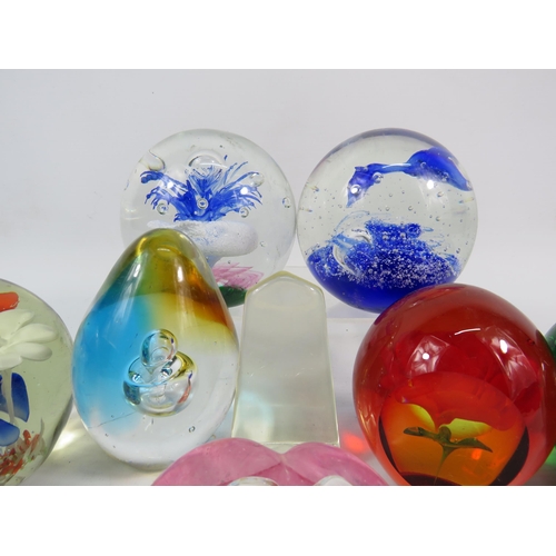 119 - Ten Art glass paperweights, the largest stands 3 3/4