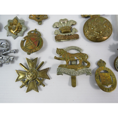 132 - Selection of WW1 and WW2 Military cap badges Button guard and Belt buckle etc.