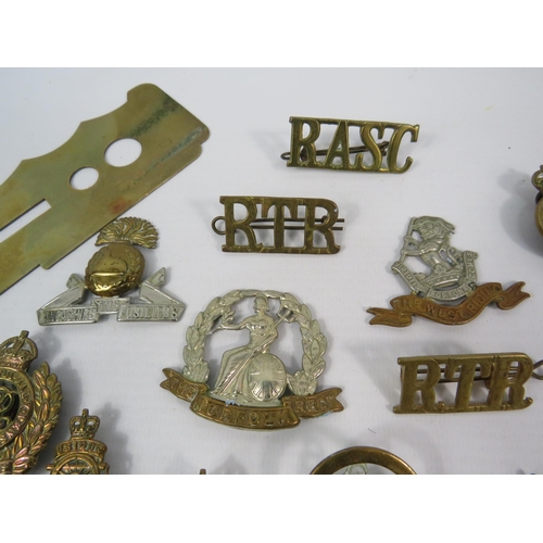 132 - Selection of WW1 and WW2 Military cap badges Button guard and Belt buckle etc.