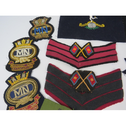 134 - Good selection of Military embroided badges and patches.