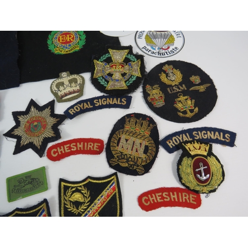 134 - Good selection of Military embroided badges and patches.