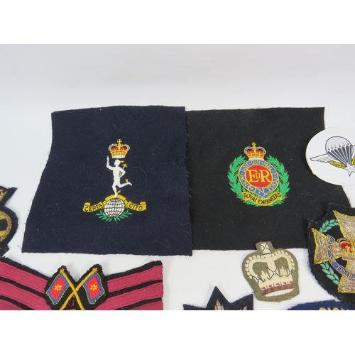 134 - Good selection of Military embroided badges and patches.