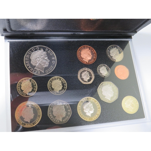 217 - Royal Mint  UK 2010 Proof Coin Set with Leatherette Folder/Holder. All coins set under perspex mount... 