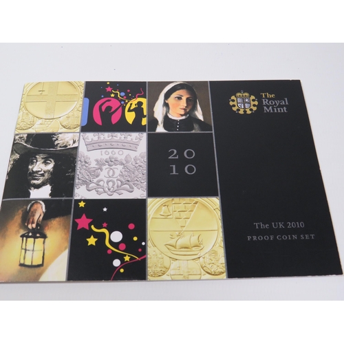 217 - Royal Mint  UK 2010 Proof Coin Set with Leatherette Folder/Holder. All coins set under perspex mount... 