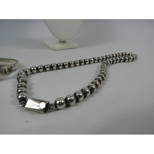 162 - Mexican 925 silver beaded necklace and solid 925 silver hinged bracelet. Total weight 109.7 grams