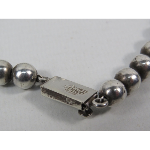 162 - Mexican 925 silver beaded necklace and solid 925 silver hinged bracelet. Total weight 109.7 grams