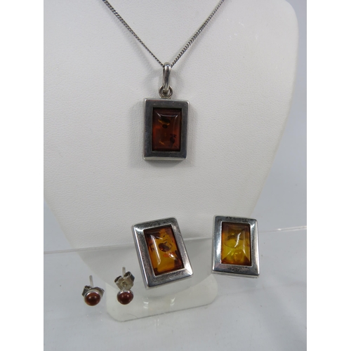 163 - 925 silver Amber Pendant and Earring set with chain plus a pair of amber stud earrings.