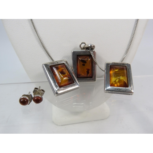 163 - 925 silver Amber Pendant and Earring set with chain plus a pair of amber stud earrings.