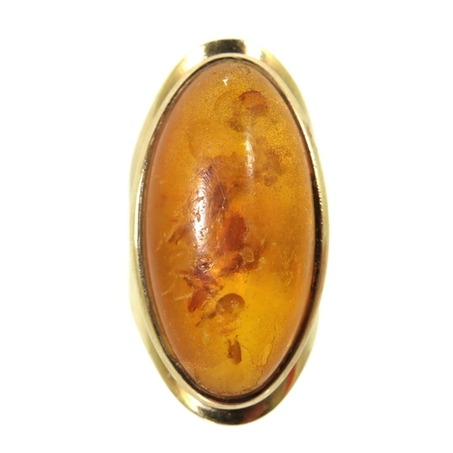 269 - Stunning 9ct Yellow Gold Ring set with a large oval Amber Cabouchon. Ring size 'M'  Inclusions to Am... 