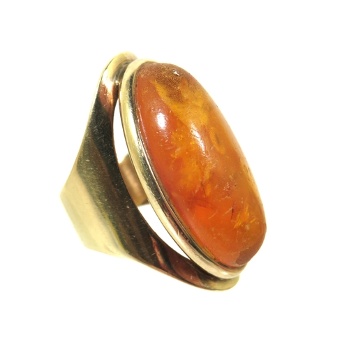 269 - Stunning 9ct Yellow Gold Ring set with a large oval Amber Cabouchon. Ring size 'M'  Inclusions to Am... 